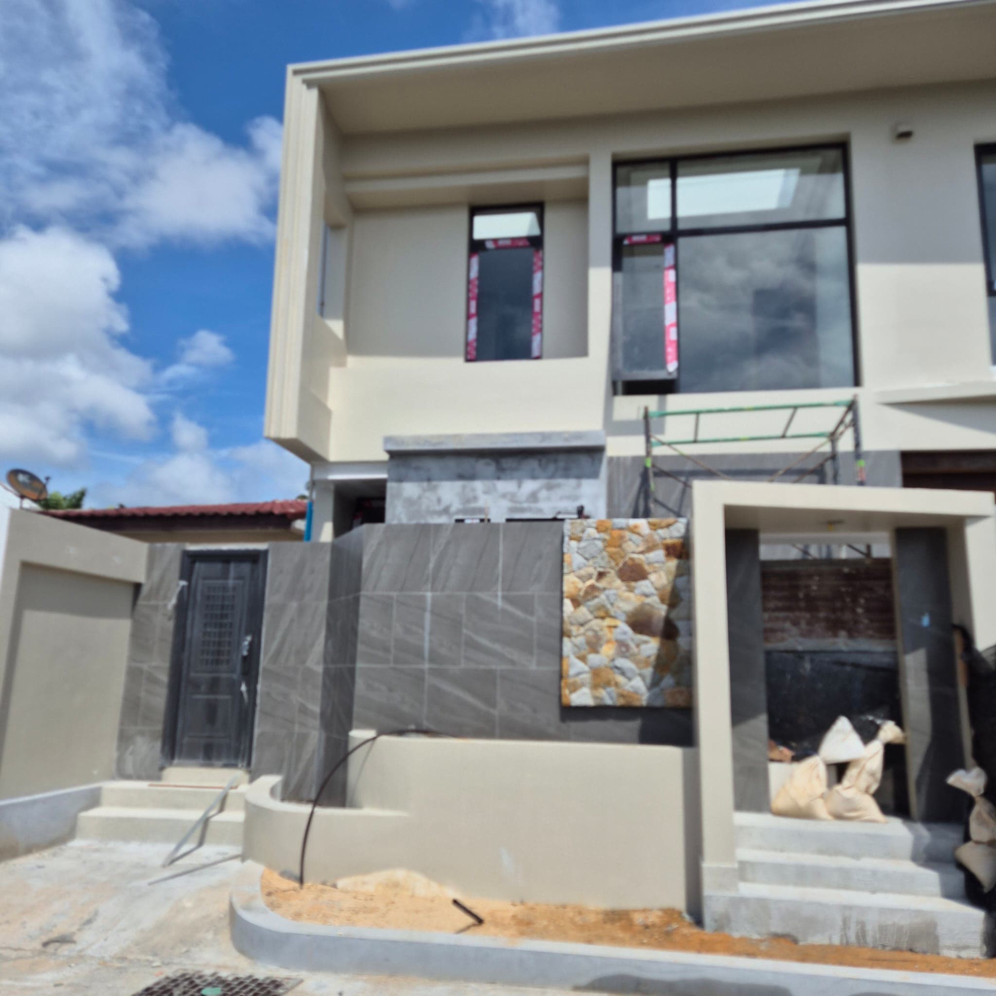 Street frontage with stone cladding and entrance steps