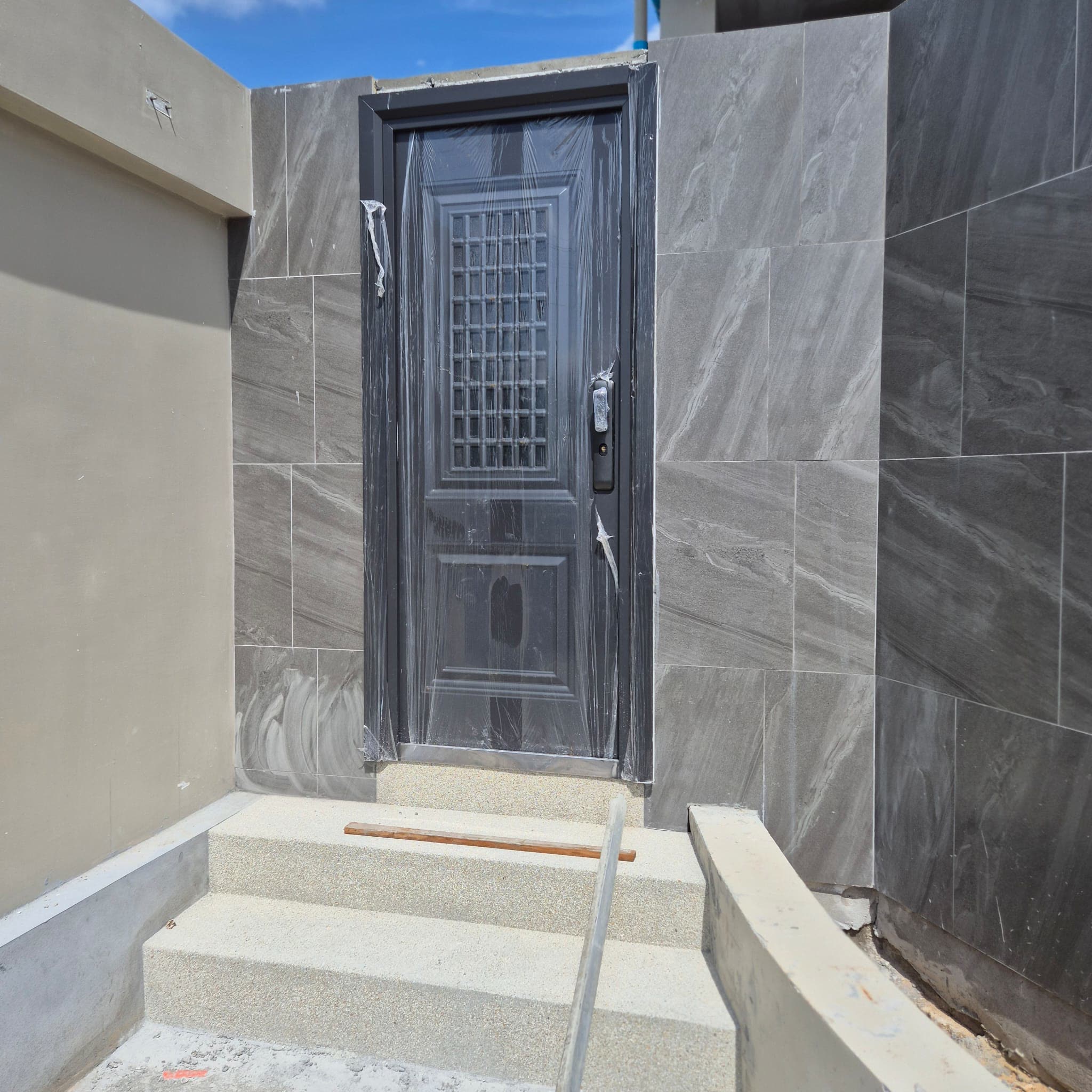 Front door installed in its stone surround