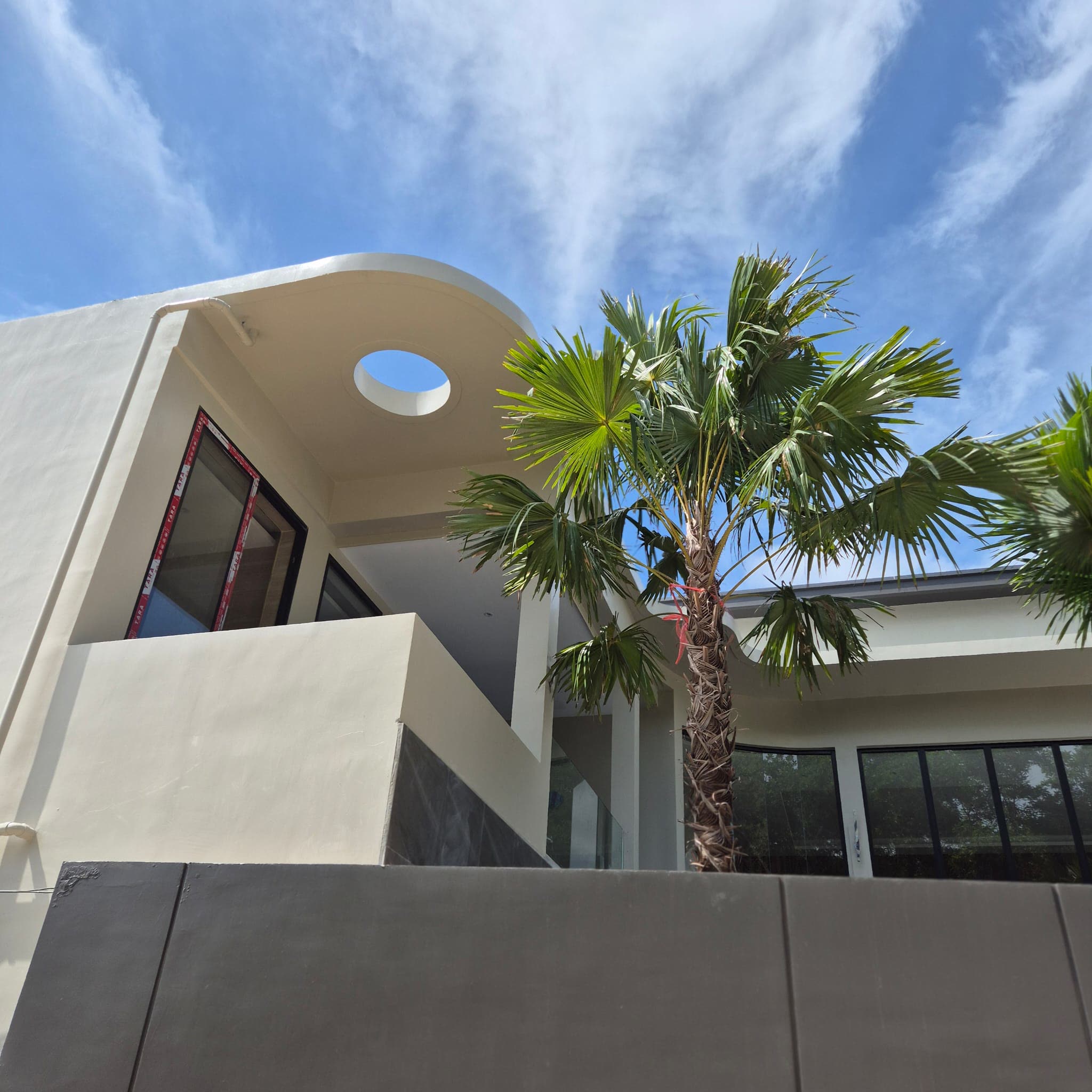 Curved roofline and porthole window