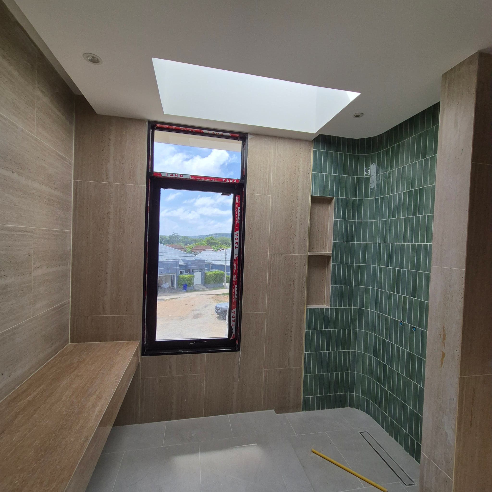Guest bathroom green tiling