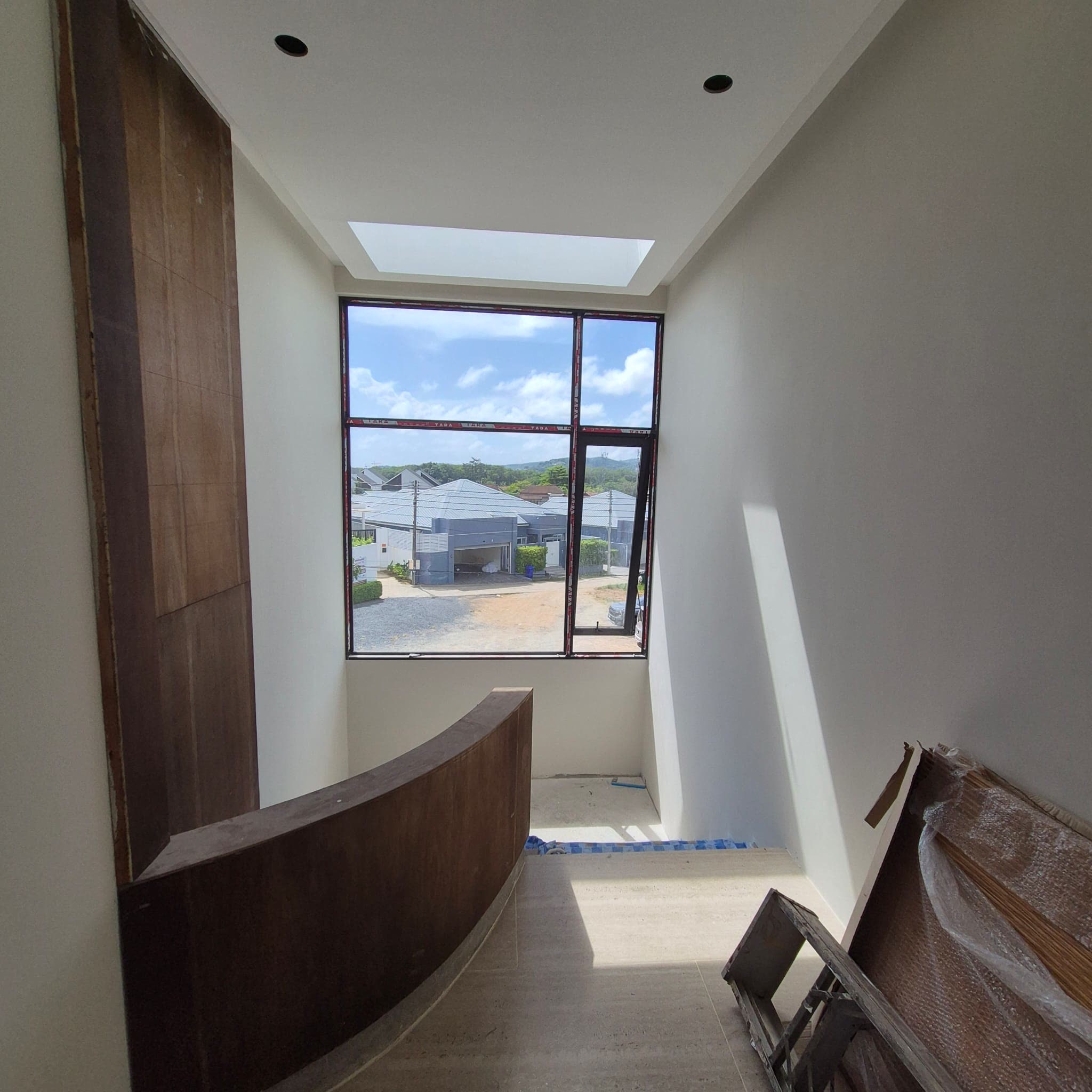 Room with skylight and curved bench